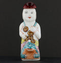 Antique Chinese Porcelain Snuff Bottle Seated Figure with Red Stopper