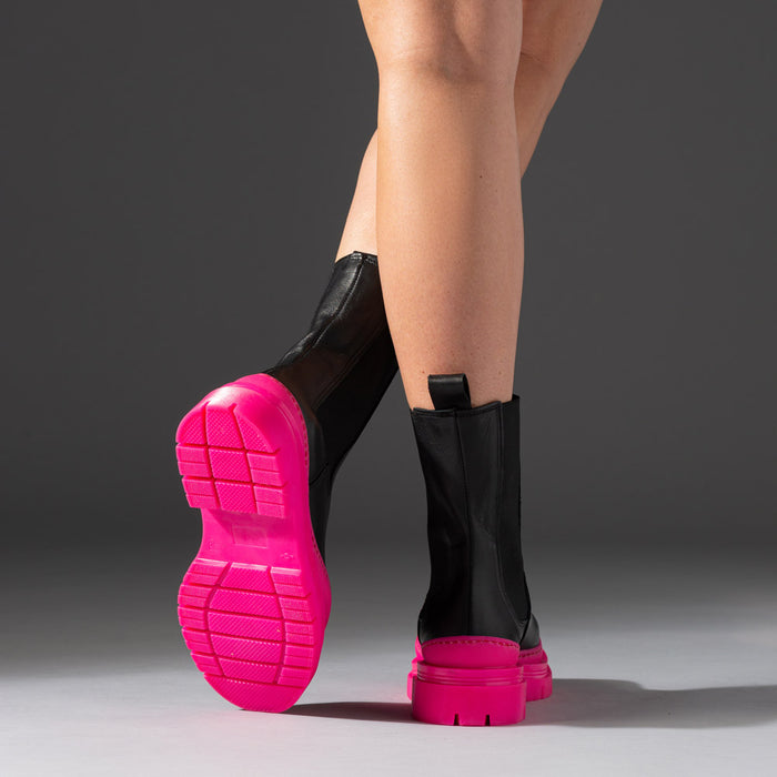 leather boots with hot pink chunky rubber soles